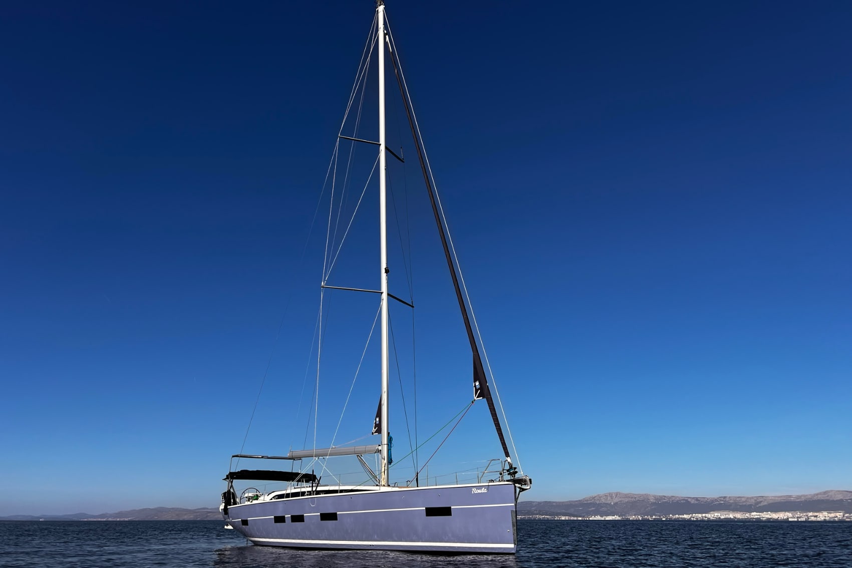 Greece sailboat a beautiful new yacht floats on deep blue Mediterranean waters in Greece
