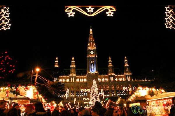 <p><em>Rathausplatz</em> Christmas market lit up at night.</p> Rathausplatz Christmas market lit up at night.